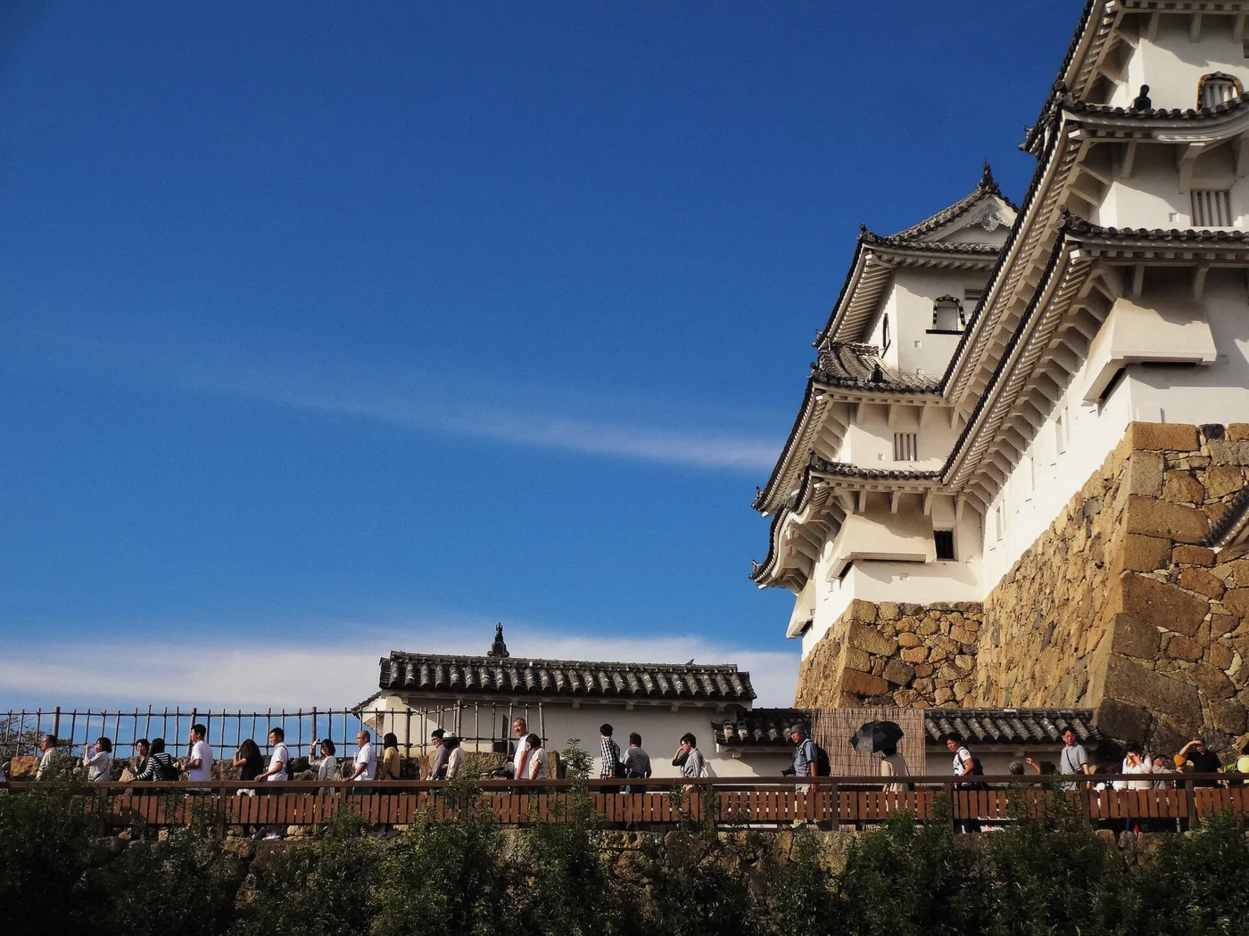Himeji Castle keep and stone base in late-summer light, Himeji, Japan