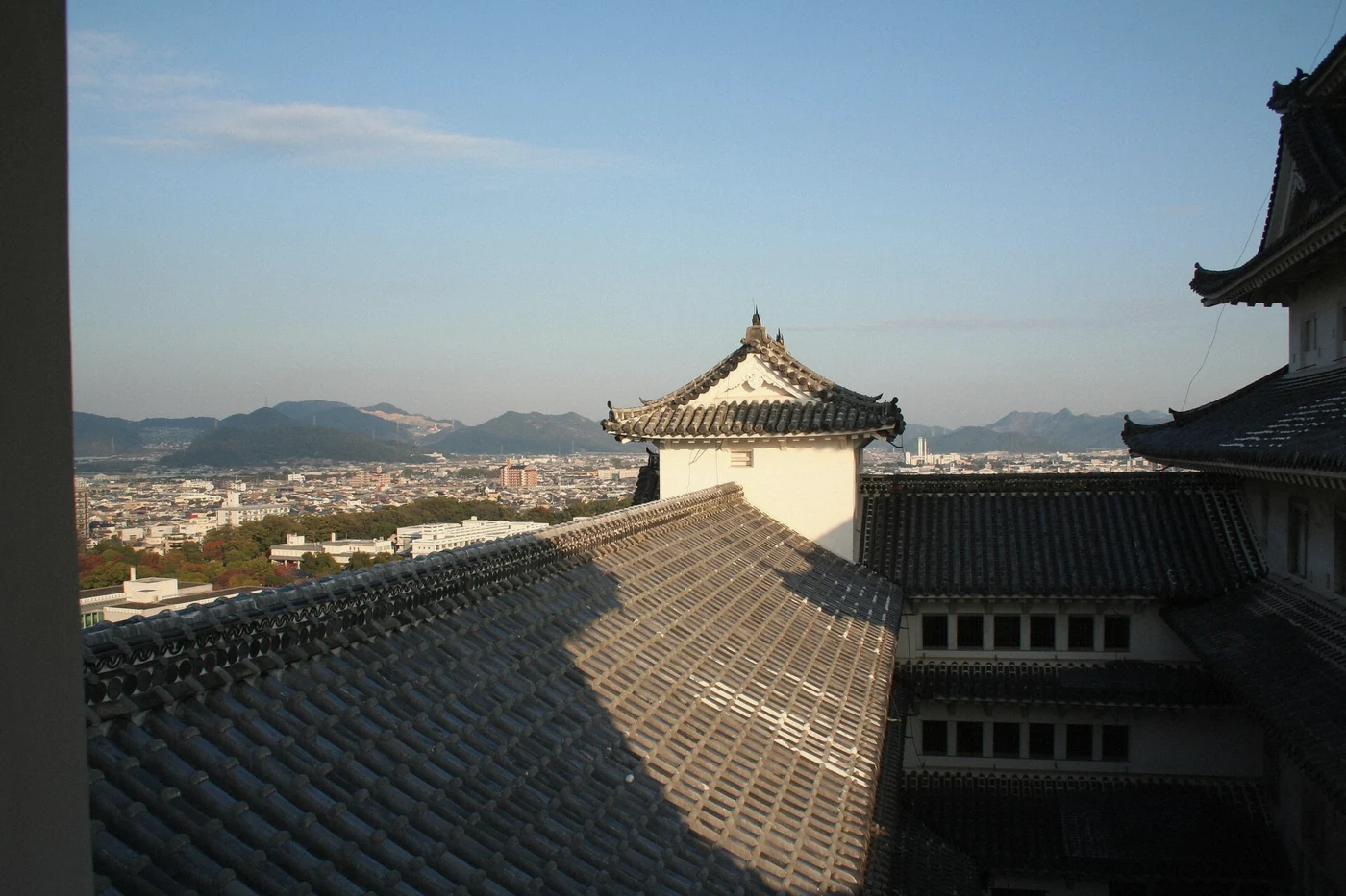 Himeji Castle keep rising over the bailey roofs, Himeji, Japan