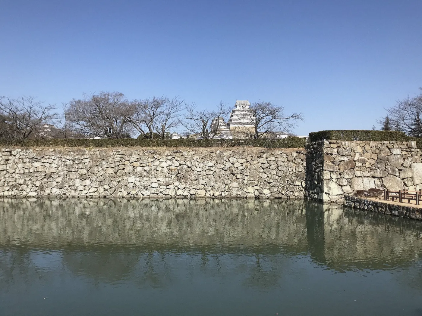 Himeji Castle moat and walls in soft afternoon light, Himeji, Japan