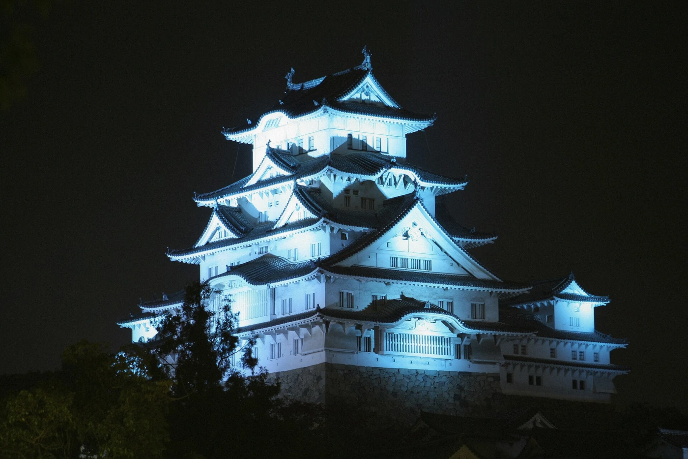 The white keep of Himeji Castle after dusk, the structure climbed on the flexible-options tour, Japan